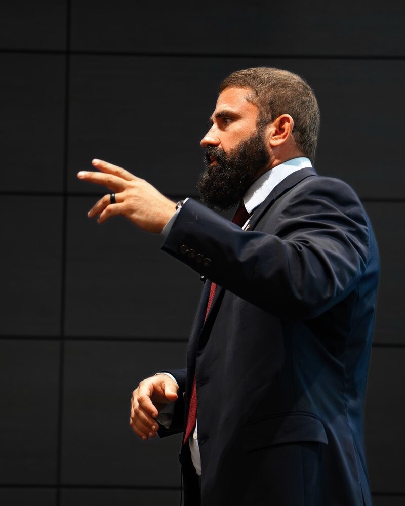 Prime Hall speaking on stage